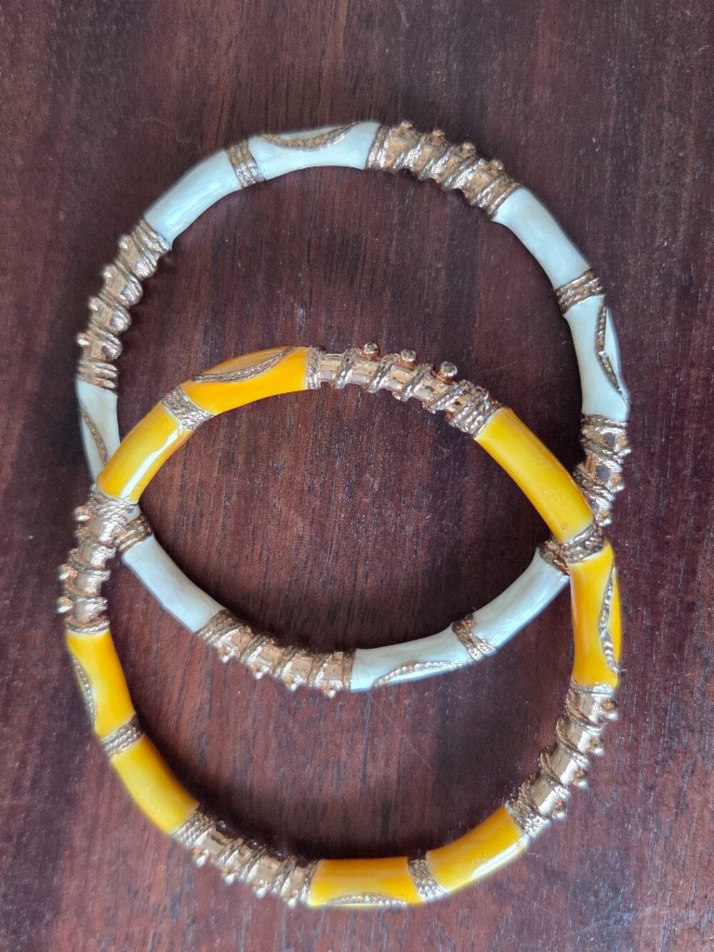 Vintage enameled bracelets yellow and white with gold tone accents